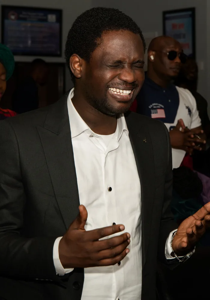 Church member praising with open hands
