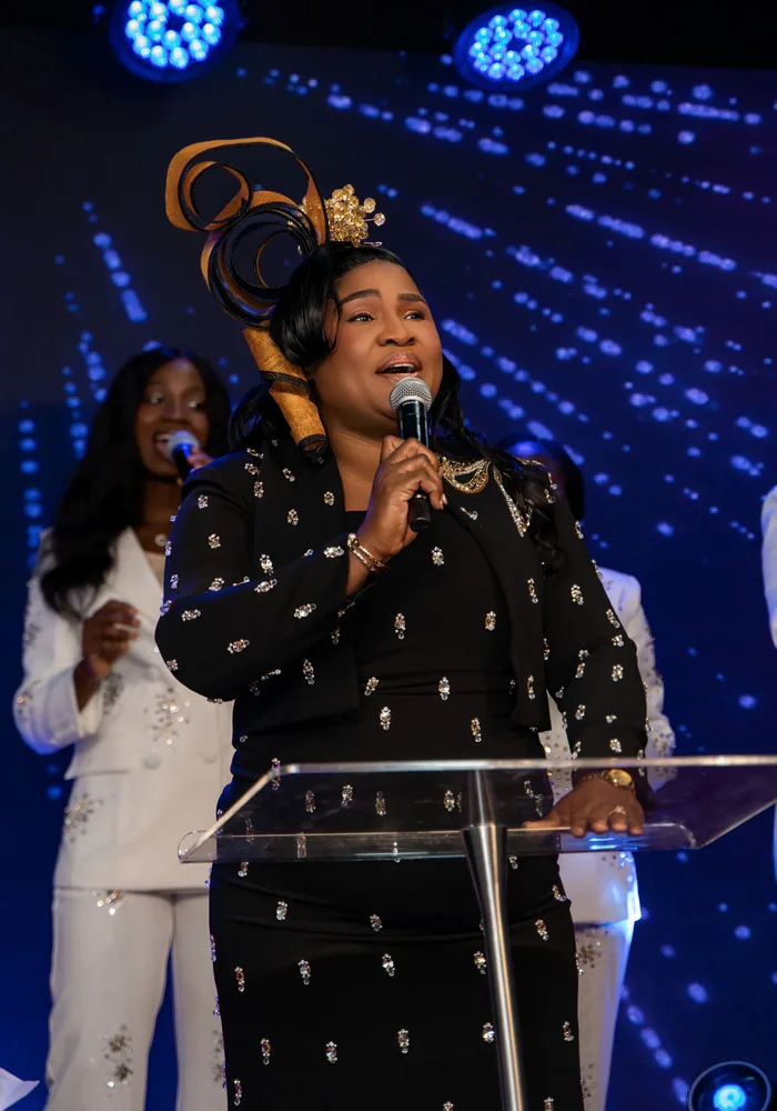 Minister leading worship at the pulpit
